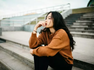 woman waiting on stairs