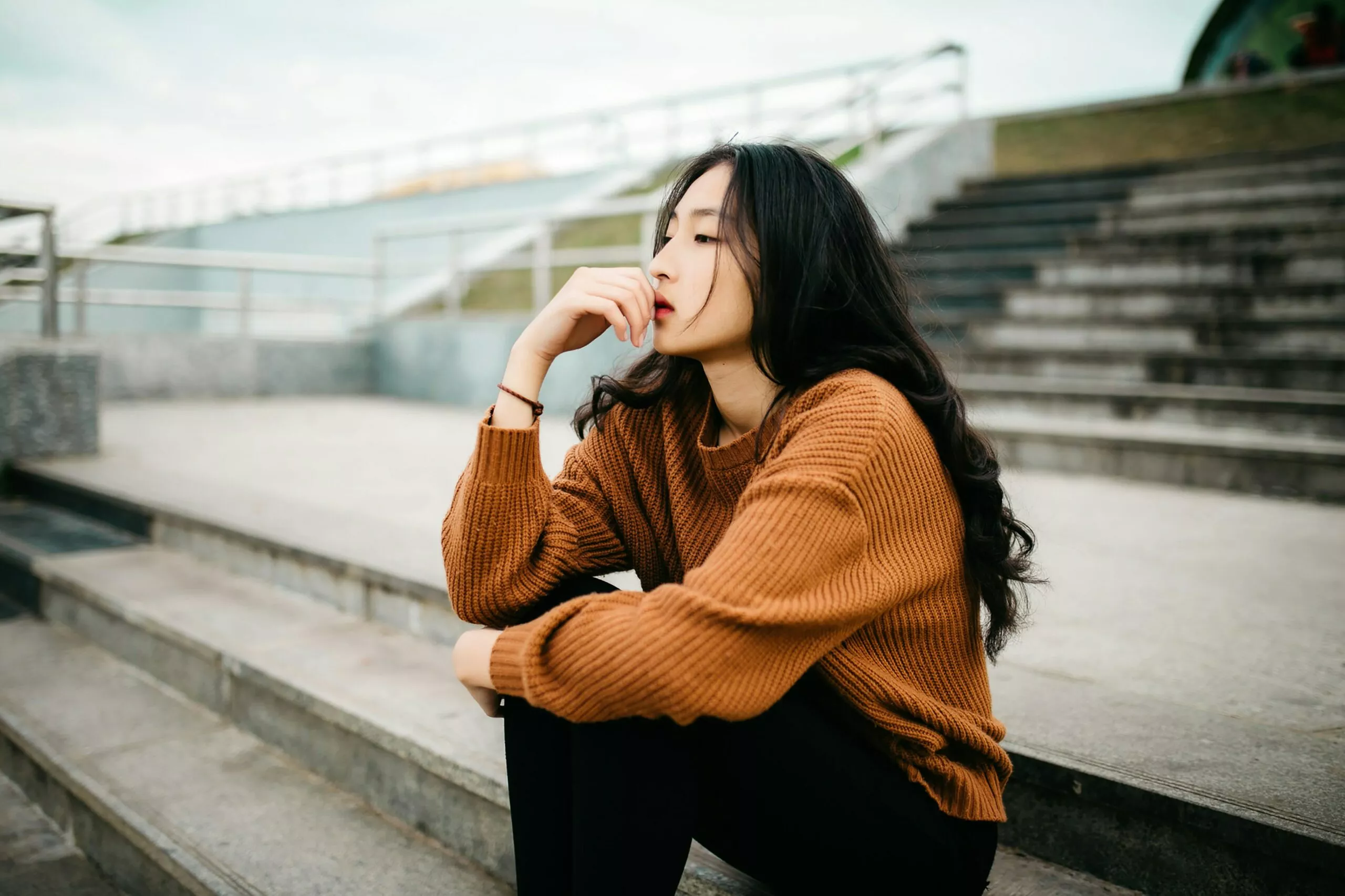 woman waiting on stairs